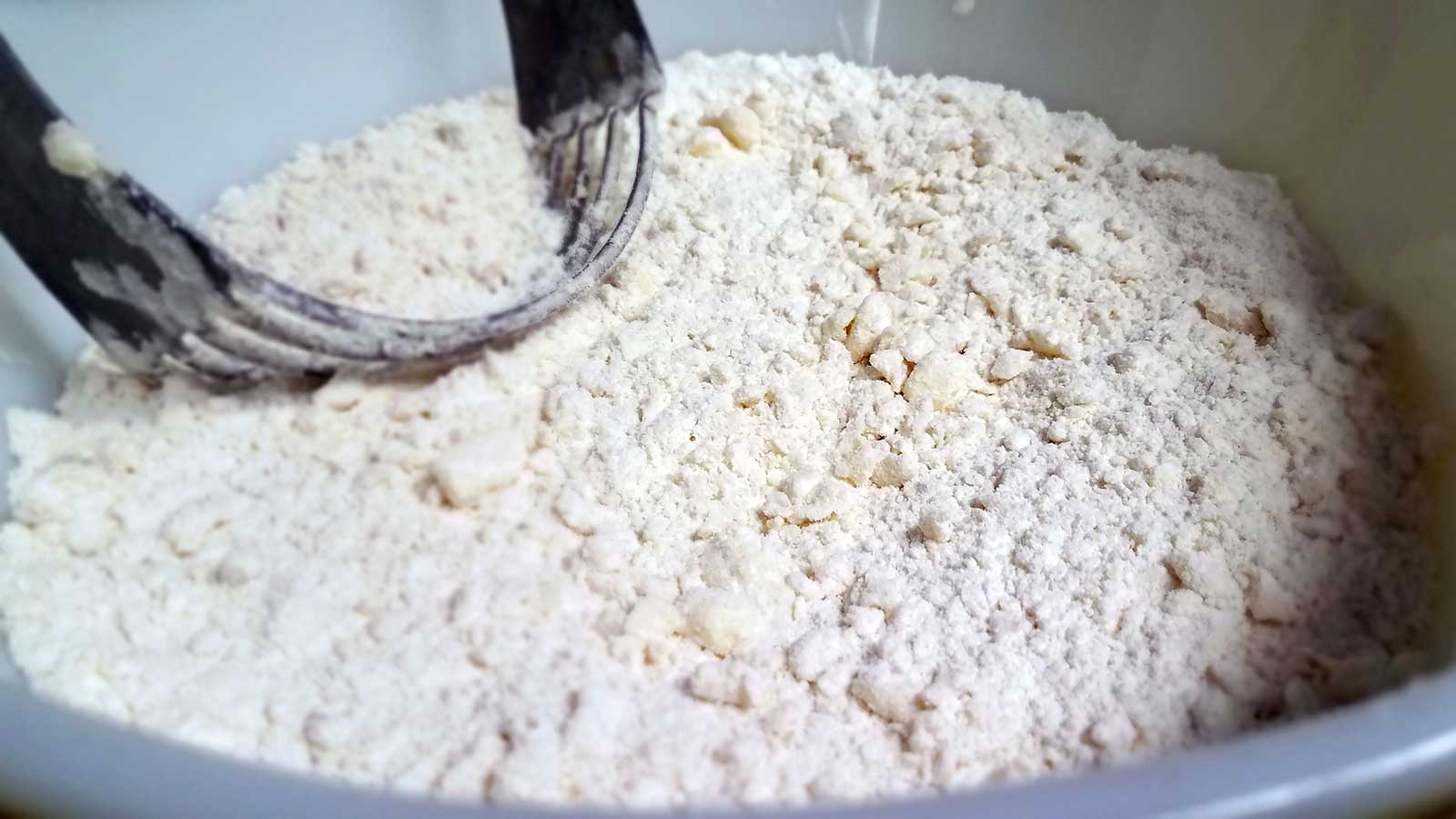 Step 2 cutting butter and lard or shortening into flour
