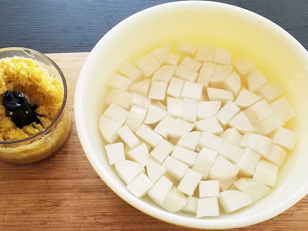 Step 2 Cutting vegetables like daikon for kimchi.