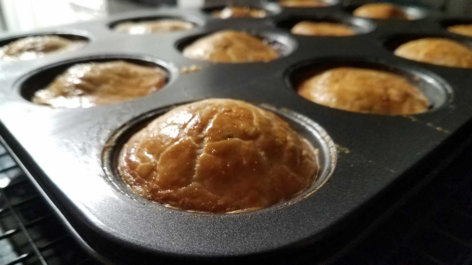 Pork pies hot out of the oven.