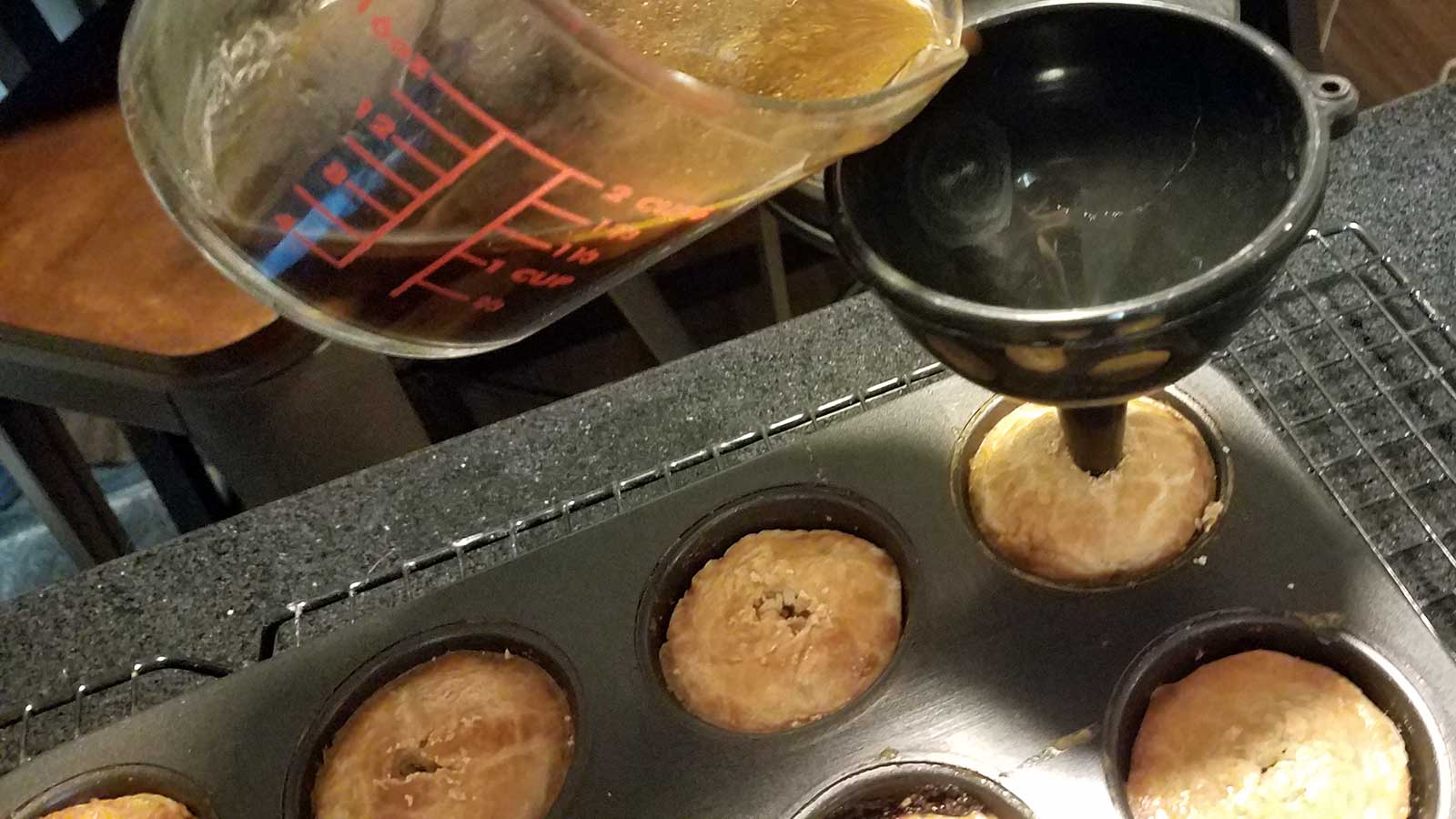 Filling pork pies with gravy