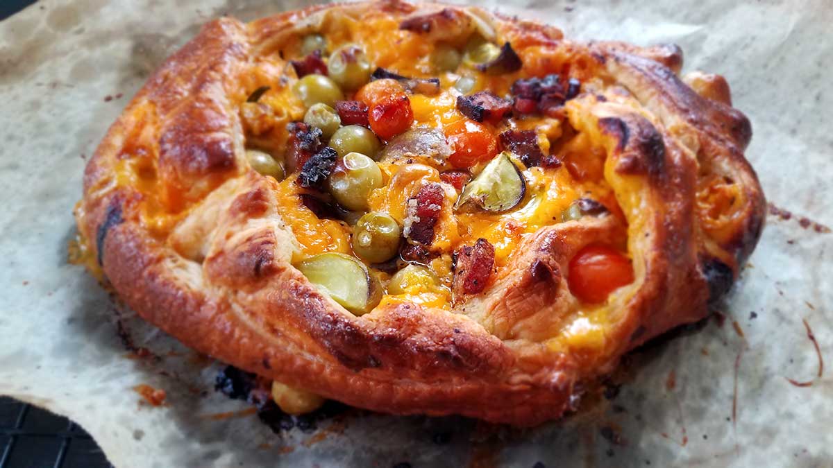 Puff pastry tart with green tomato bacon cheese filling