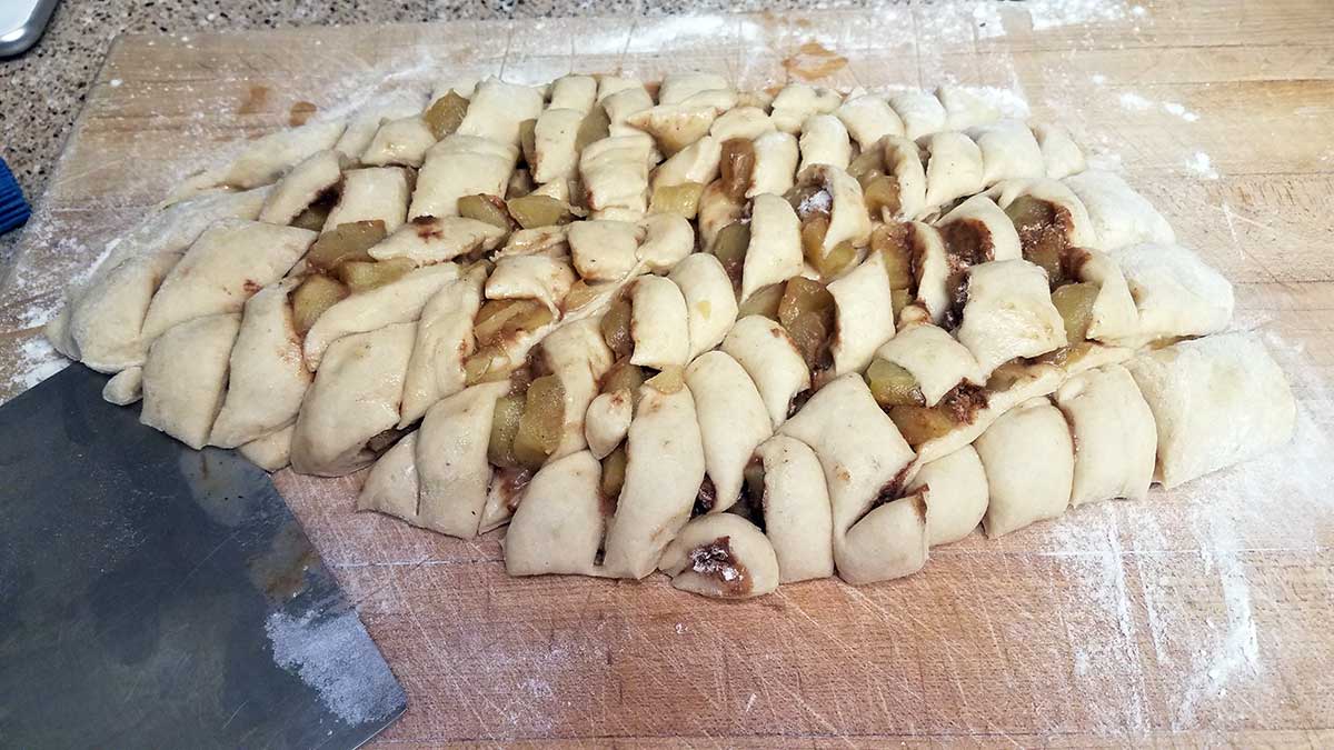 Cutting apple fritter dough