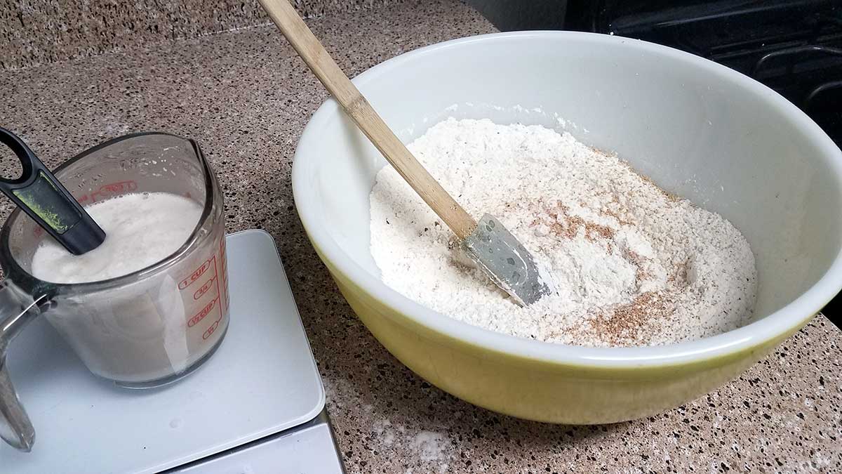 Mixing wet and dry for apple fritters.